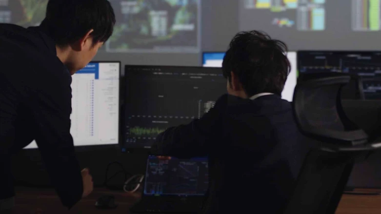 Specialists analyzing power plant operating data