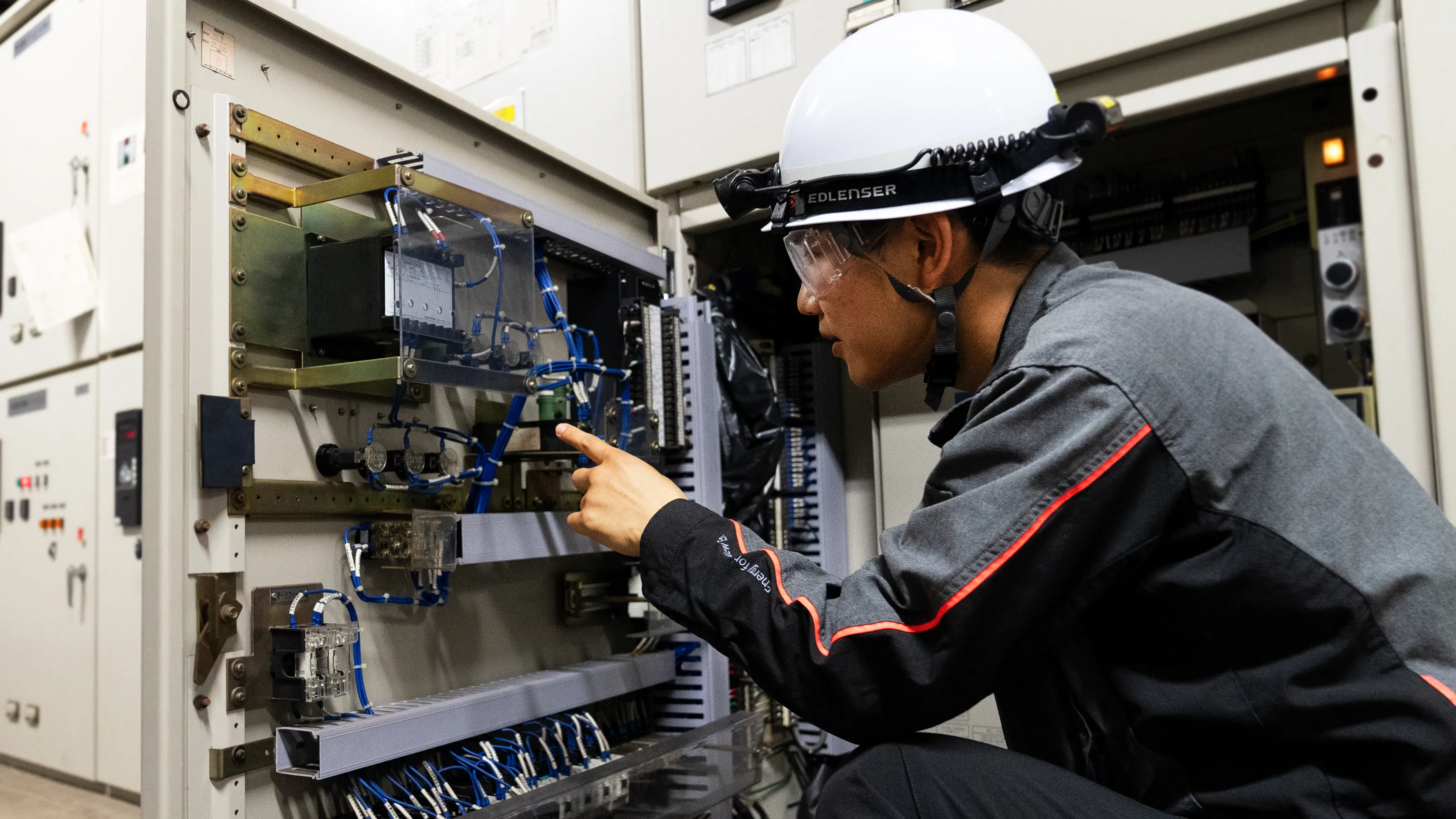 An engineer inspecting electrical equipment