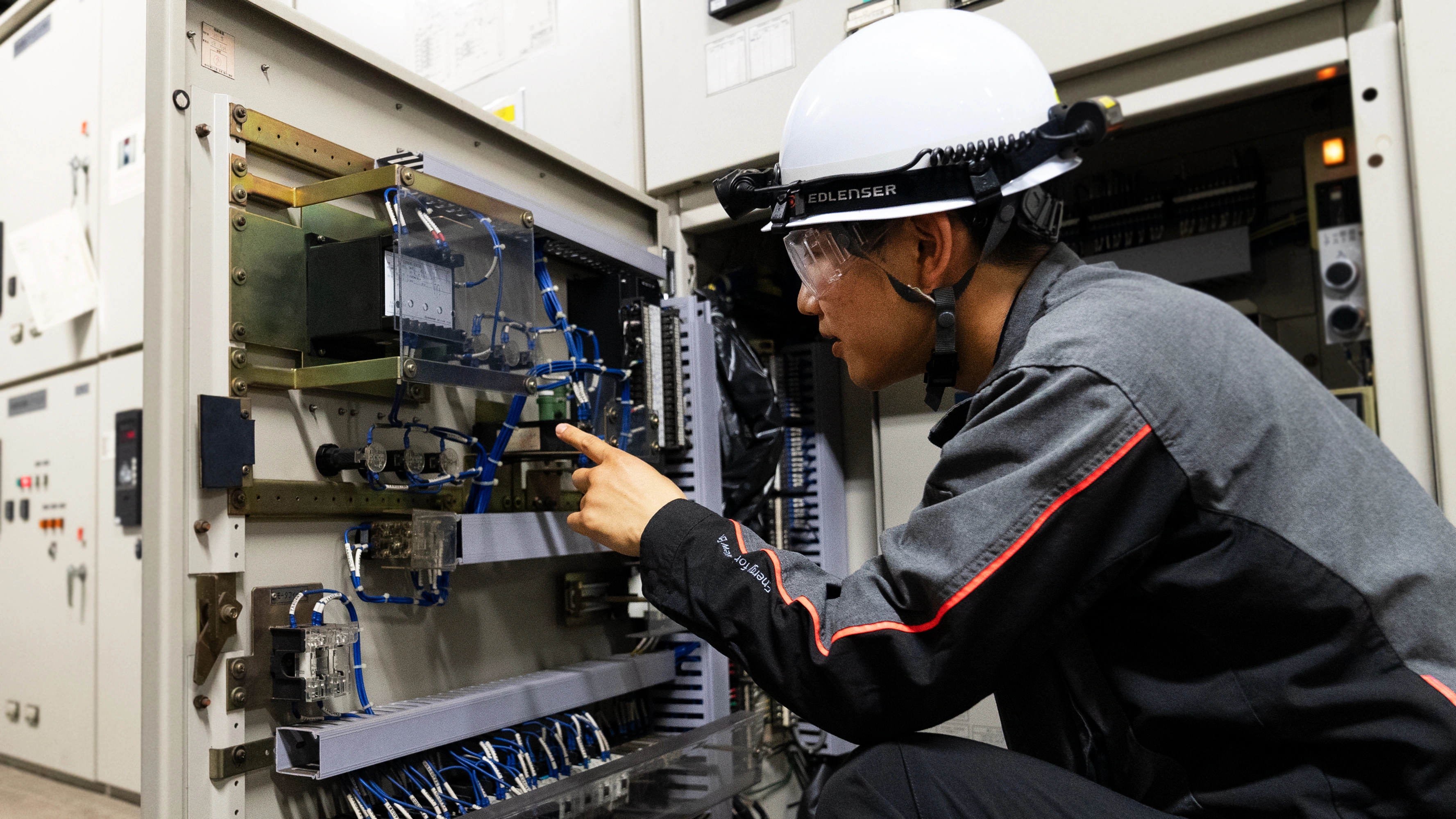 An engineer inspecting electrical equipment